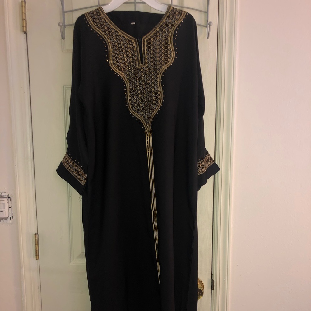 A Black Dress with Gold Accents